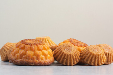 Sweet delicious cupcakes on white background