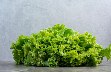 Fresh lettuce leaves on white background