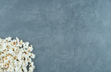 Pile of toothsome popcorn on marble background