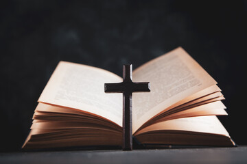 open book and cross on the table