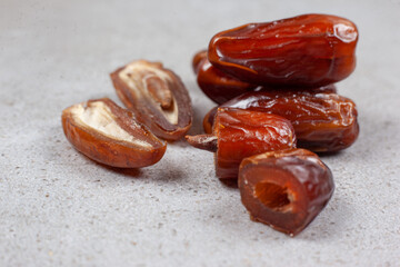 A small bundle of fresh dates on marble background