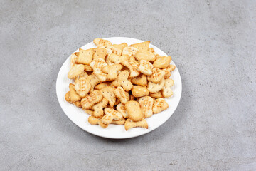 A platter full of crispy crackers on marble background