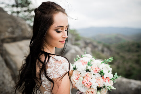 Bride holding big and beautiful wedding bouquet with flowers