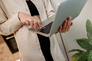 Close up of businesswoman freelancer working  laptop at home office on kitchen