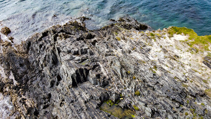Rocks on the seashore. Geological formations, top view.