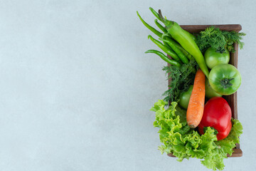 Fresh mixed vegetables in wooden box