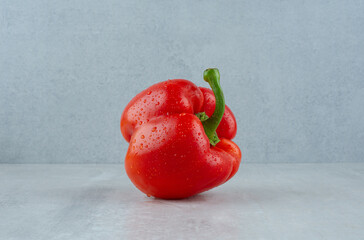 Red bell pepper on stone background