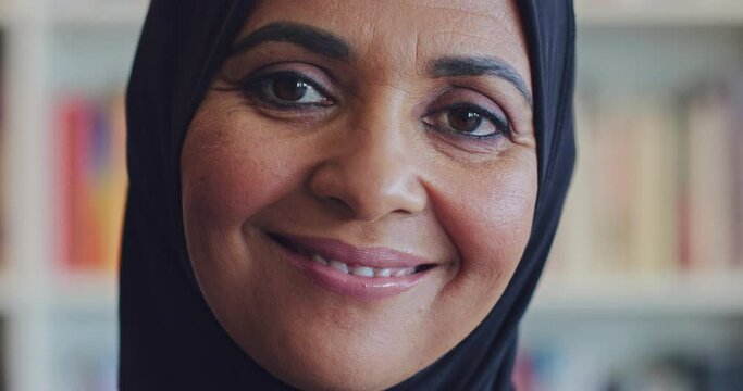 Portrait face, Islamic and university professor working at college campus, library or professional workplace for education and knowledge. Muslim law teacher with books in background of room for study