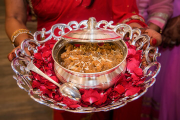 Moong dal halwa is a classic Indian sweet dish made with moong lentils, sugar, ghee(clarified butter). Sweet dessert pudding from India. Garnished with almond nuts