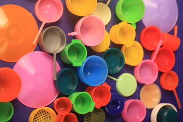 toys pans cups on blue background