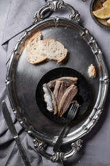 Ready to eat marinated sardines fillets on the table, healthy simple eating concept