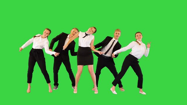 A group of happy office workers dancing on a Green Screen, Chroma Key.