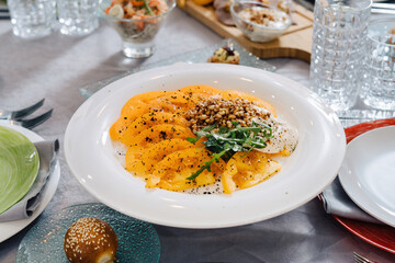 Buckwheat popcorn with tomatoes, laid festive table.