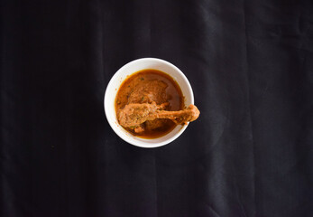 Spicy red chicken curry. Chicken Jhaal masala. Butter chicken Murgh Makhani curry roast hot and spicy gravy dish Dhaba Punjab, India. North Indian non-vegetarian cuisine Garam Masala. tikka