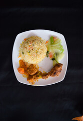 Fried rice with chicken fry and curry. Thai rice with veg and chicken crispy with masala.