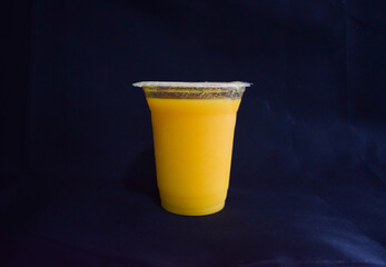 Mango Juice on Black Background Isolated.