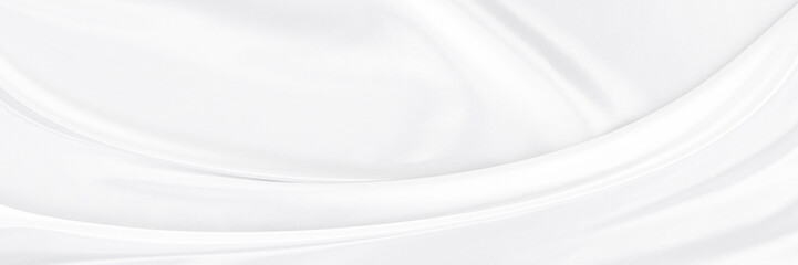White gray satin texture that is white silver fabric silk panorama background with beautiful soft blur pattern natural.