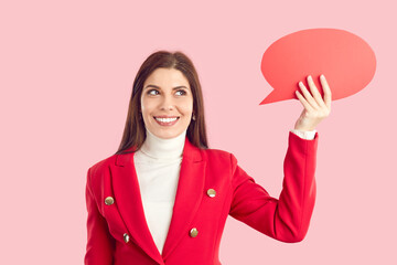 Beautiful young woman holding thinking bubble. Happy cheerful pretty business lady in smart red...