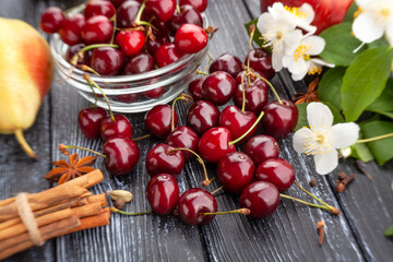 red cherries on wood background