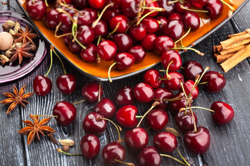 red cherries on wood background
