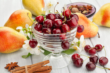 red cherries on wood background