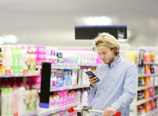 shopping in supermarket.(washing powder,detergent,shampoo, soap)