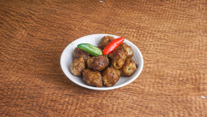 Homemade Bakso Bakar, Indonesian Chicken Meatball grilled in a bowl