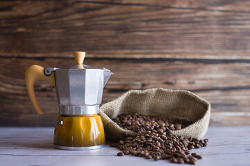 Still life with coffee, moka pot and coffee bag