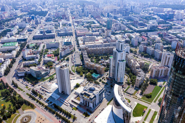 Fototapeta na wymiar Aerial view of central part of modern city with skyscrapers and residential buildings
