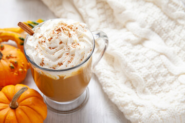 Obraz na płótnie Canvas Pumpkin latte in a glasses. Autumn drink for Halloween or Thanksgiving.