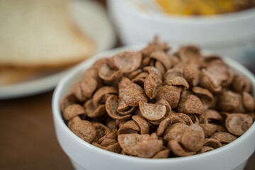Cornflakes Breakfast on wooden table.