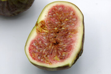 Sliced figs isolated on white background