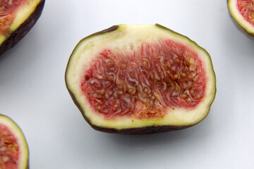 Sliced figs isolated on white background