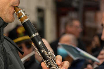 Fototapeta premium Musician From A Popular Band Playing Clarinet During A Religious Procession