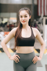 Asian female fitness athlete in gym