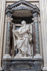 Fototapeta na wymiar The Statue of Saint Matthew inside the Basilica Maggiore of San Giovanni in Laterano in Rome