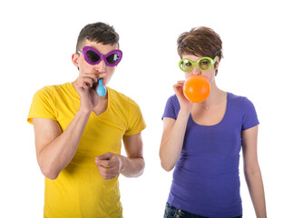 Man and woman with sunglasses blowing balloons isolated on transparent background