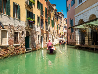 Fototapeta na wymiar Venezia green water Lagoon embedded with mediterranean Architecture 