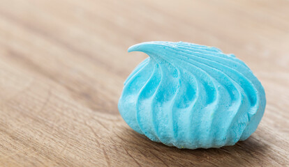 delicious and sweet meringue in blue color close-up