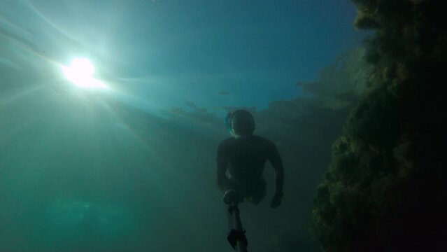 Underwater Shooting Male Friends Are Snorkeling Underwater On A Sunny Day. First Person View From Action Camera. Diving Freediving