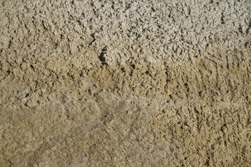 Braun-weißer Sand mit Muster