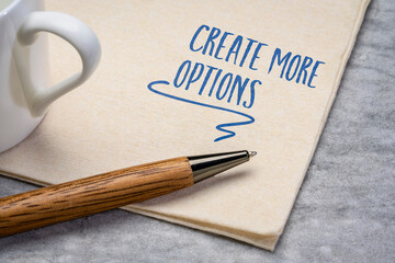 Create more options inspirational note. Motivational handwriting on a napkin with a cup of coffee. Business and personal development concept.
