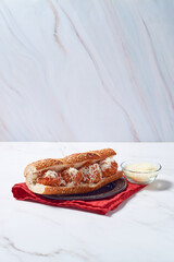 Meatball sandwich with tomato sauce and cheese on a hoagie roll