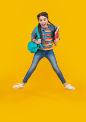 Excited teen girl screaming in midair. Teenage girl back to school. Energetic girl jumping