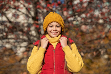 teen girl smile at school time outdoor in autumn season
