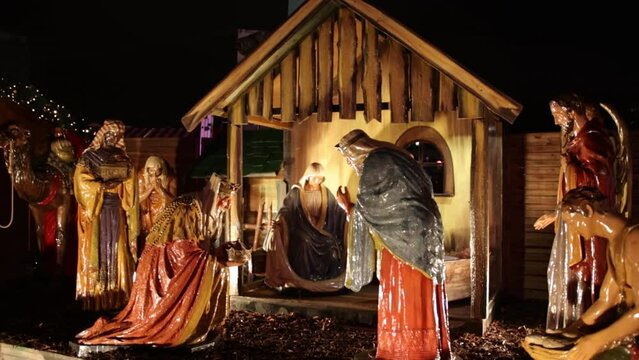 Nativity scene birth of christ. Christmas manger scene with figurines including jesus, mary, joseph, sheep and magi, and christmas nativity scene jesus christ, mary and joseph in an old barn.