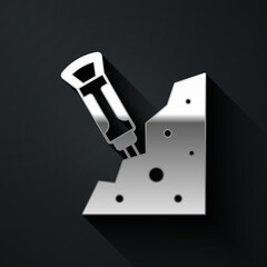 Silver Construction jackhammer and stone icon isolated on black background. Long shadow style. Vector