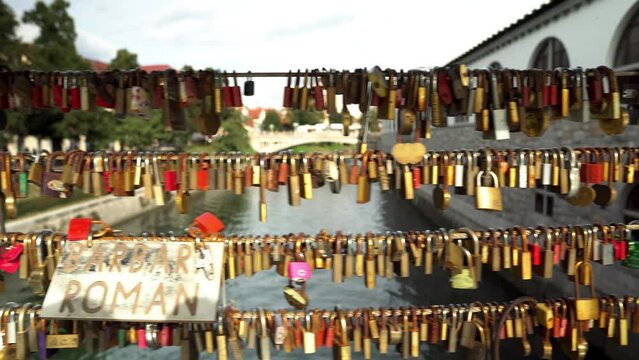 Butcher's Bridge in Ljubljana. Pedestrian bridge over the river Ljubljana in Ljubljana. Bridge of lovers in Ljubljana. Locks of lovers along the railing as a sign of love and fidelity to each other.