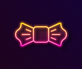 Glowing neon line Bow tie icon isolated on black background. Vector