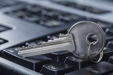 Protecting personal data and money , key on computer keyboard.